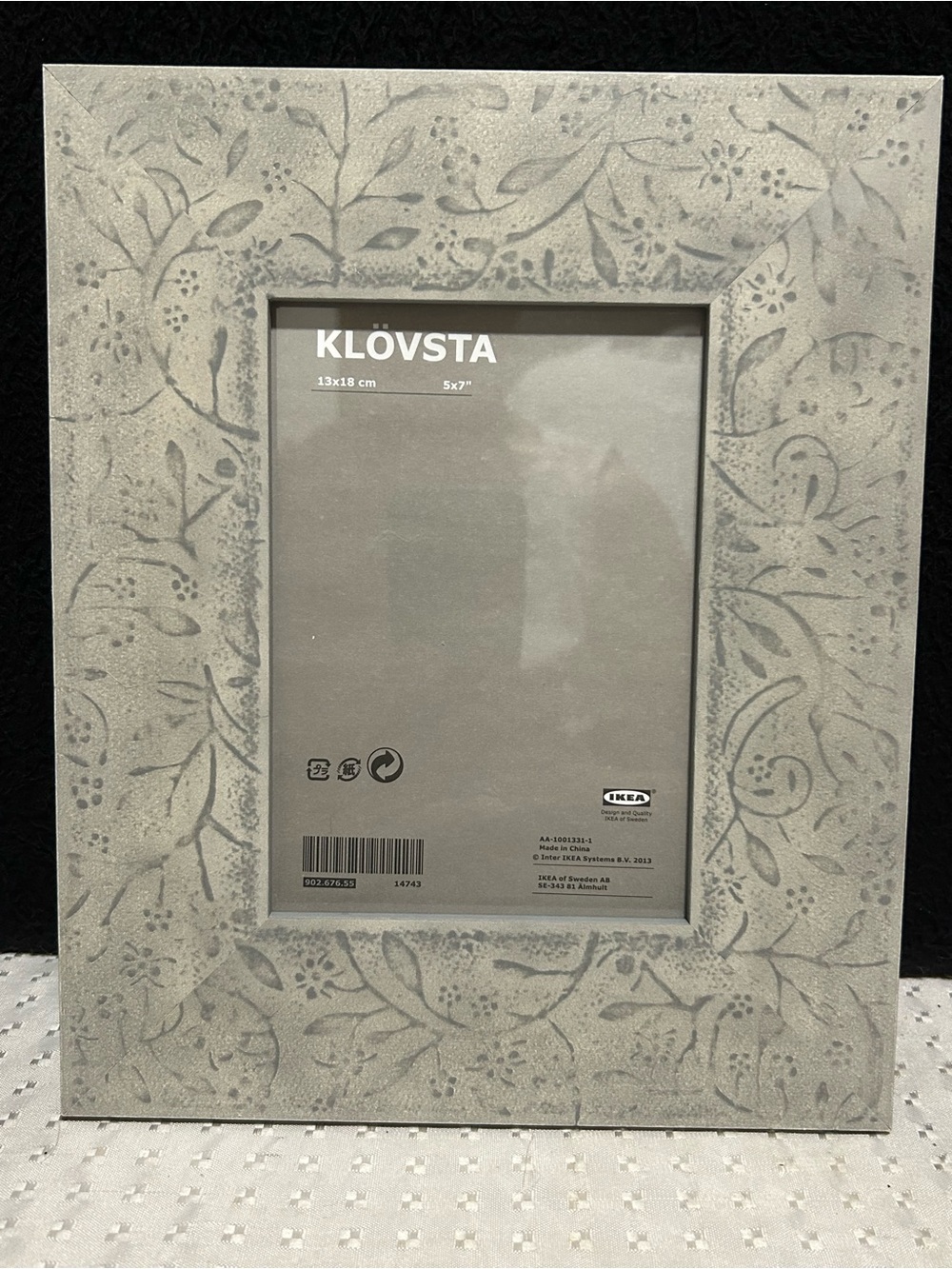 IKEA KLÖVSTA Picture Frame in gray with a stamped floral and leaf pattern